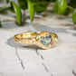 Australian Sapphire ring in solid 14k gold from the Pea in a Pod Collection, featuring a teal color stone on a textured band.