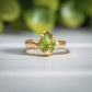 Unique handcrafted Peridot ring set in solid 14k gold with organic textured band, perfect for August birthdays.