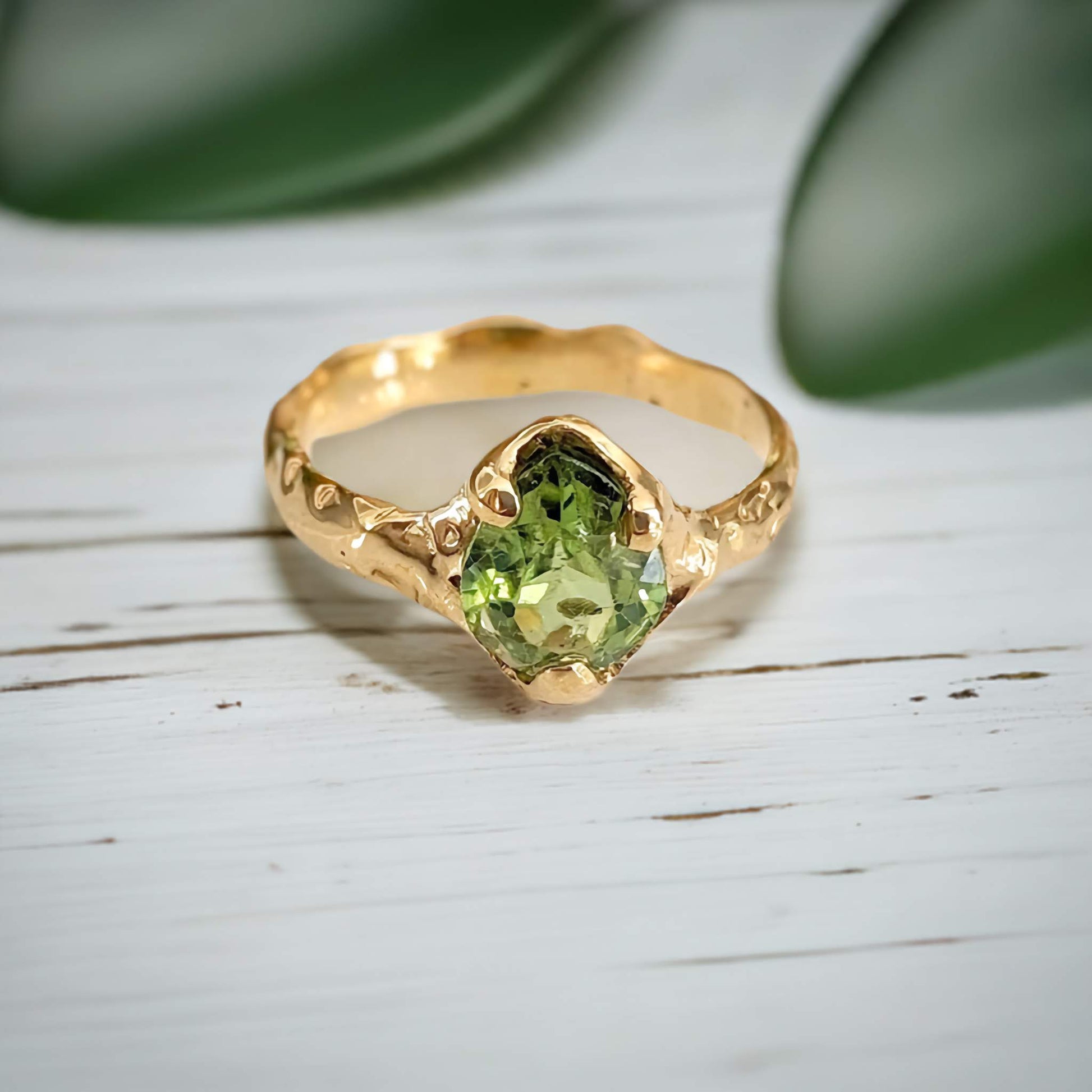 Unique handcrafted Peridot ring in solid 14k gold with organic textured band, perfect for August birthdays.