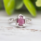 Hand-carved pink sapphire ring in solid sterling silver, showcasing a unique textured design and pear-shaped stone.
