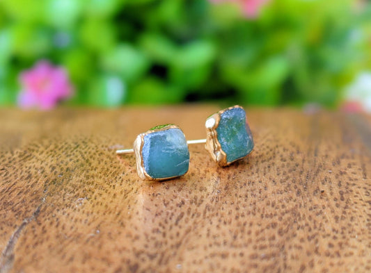 Raw Peruvian Opal stud earrings in 14k Gold filled settings, showcasing ocean-like hues of blue and green.