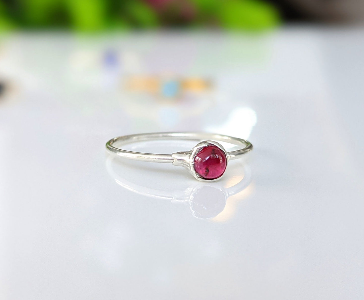Dainty Ruby stacking ring in 18k Gold with a 4mm natural Ruby on a minimalist silver band.
