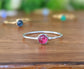 Dainty Ruby stacking ring set on a Sterling Silver band, featuring a 4mm natural Ruby gemstone.