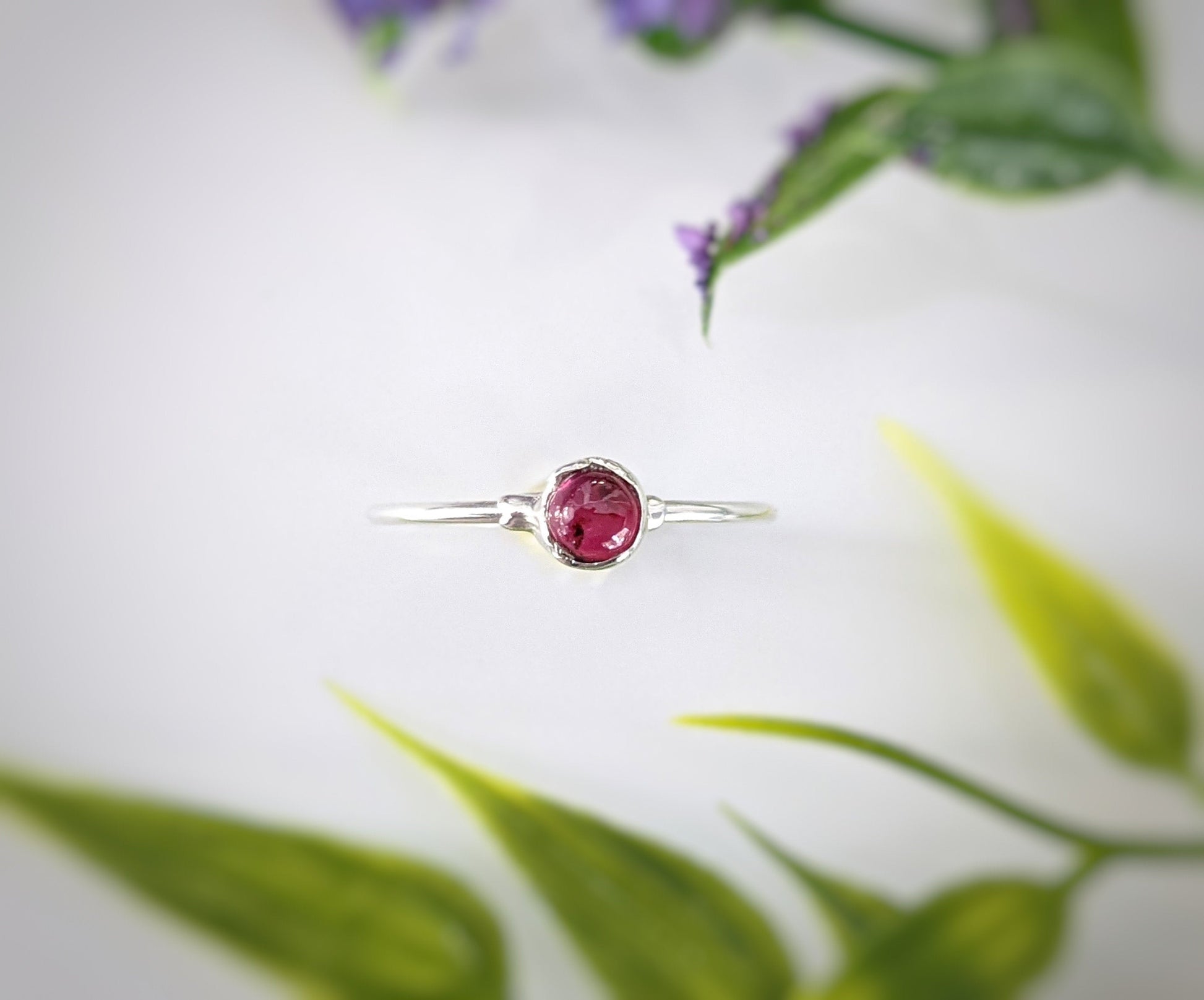 Dainty 18k gold stacking ring featuring a 4mm natural Ruby gemstone, ideal for everyday wear or stacking.