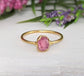 Raw pink spinel ring in gold setting, featuring natural uncut edges and a blush pink hue, ideal for gifts.