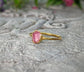 Raw pink spinel ring with a gold setting, highlighting its natural beauty and organic design.