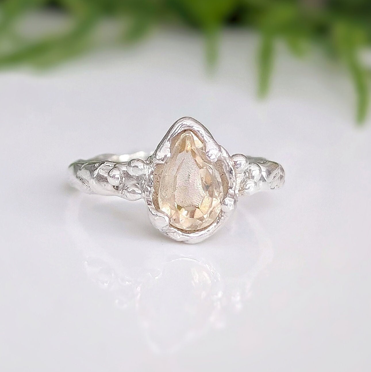 Natural Citrine pear-shaped crystal ring in textured Sterling Silver, perfect for engagement or as a November birthstone gift.