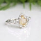 Handcrafted pear shape citrine silver ring with a textured band, showcasing natural charm and elegance.