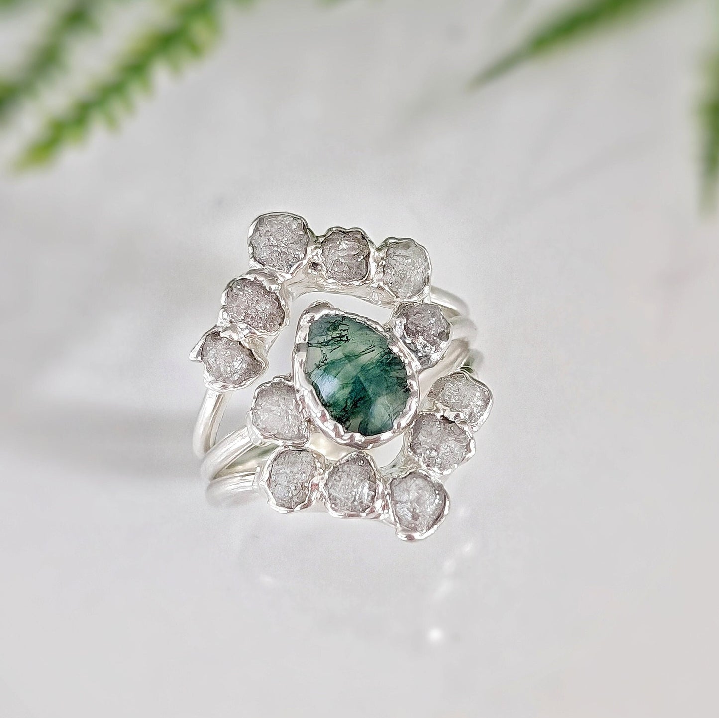 Moss Agate and raw diamond wedding ring set on sterling silver, featuring unique design and natural elegance.