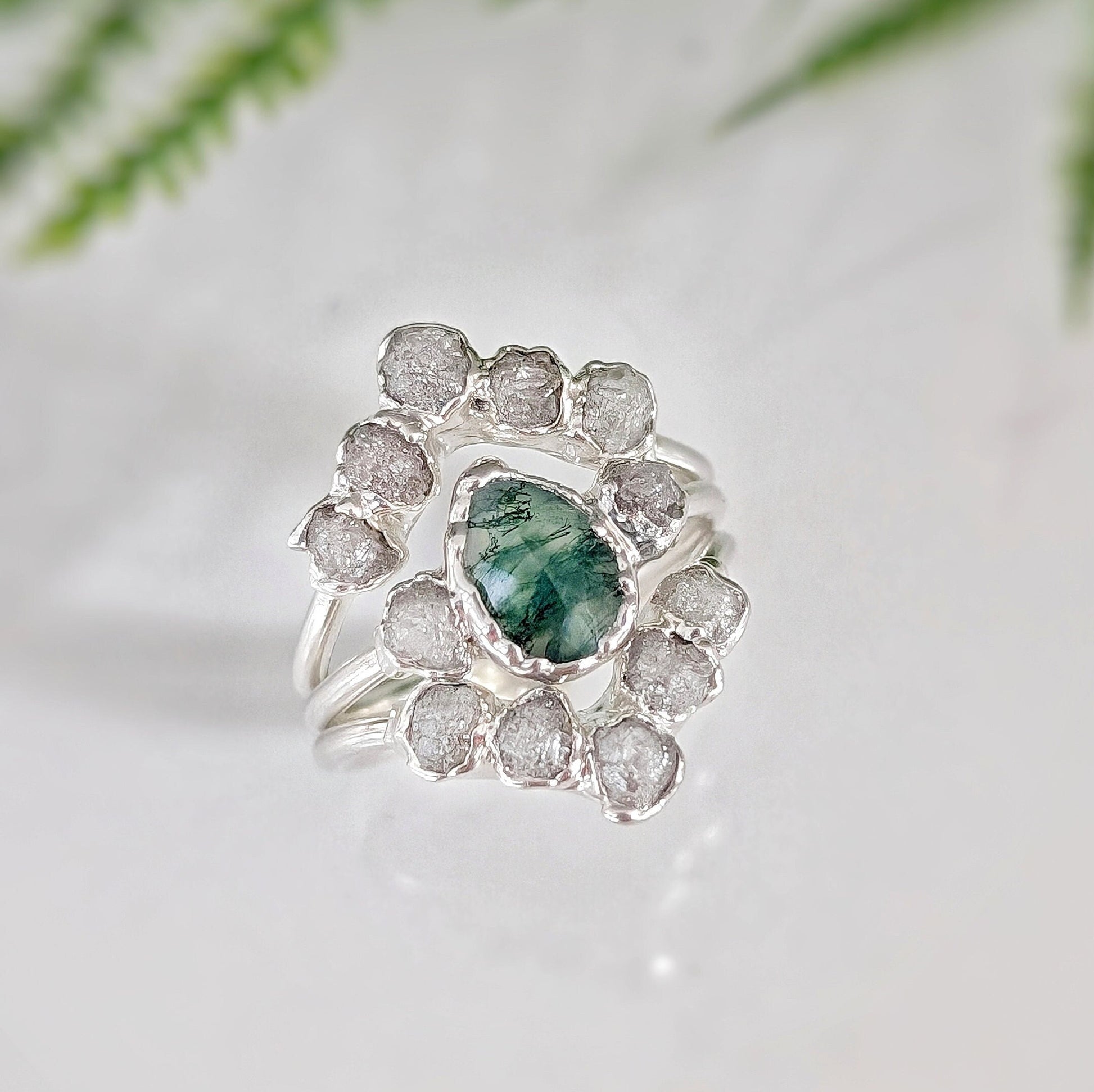 Moss Agate and raw diamond wedding ring set on sterling silver, featuring unique design and natural elegance.
