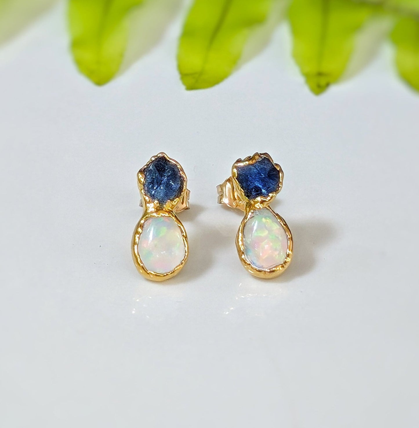 Dainty raw Sapphire and Opal stud earrings with gold setting, perfect for bridal or everyday elegance.