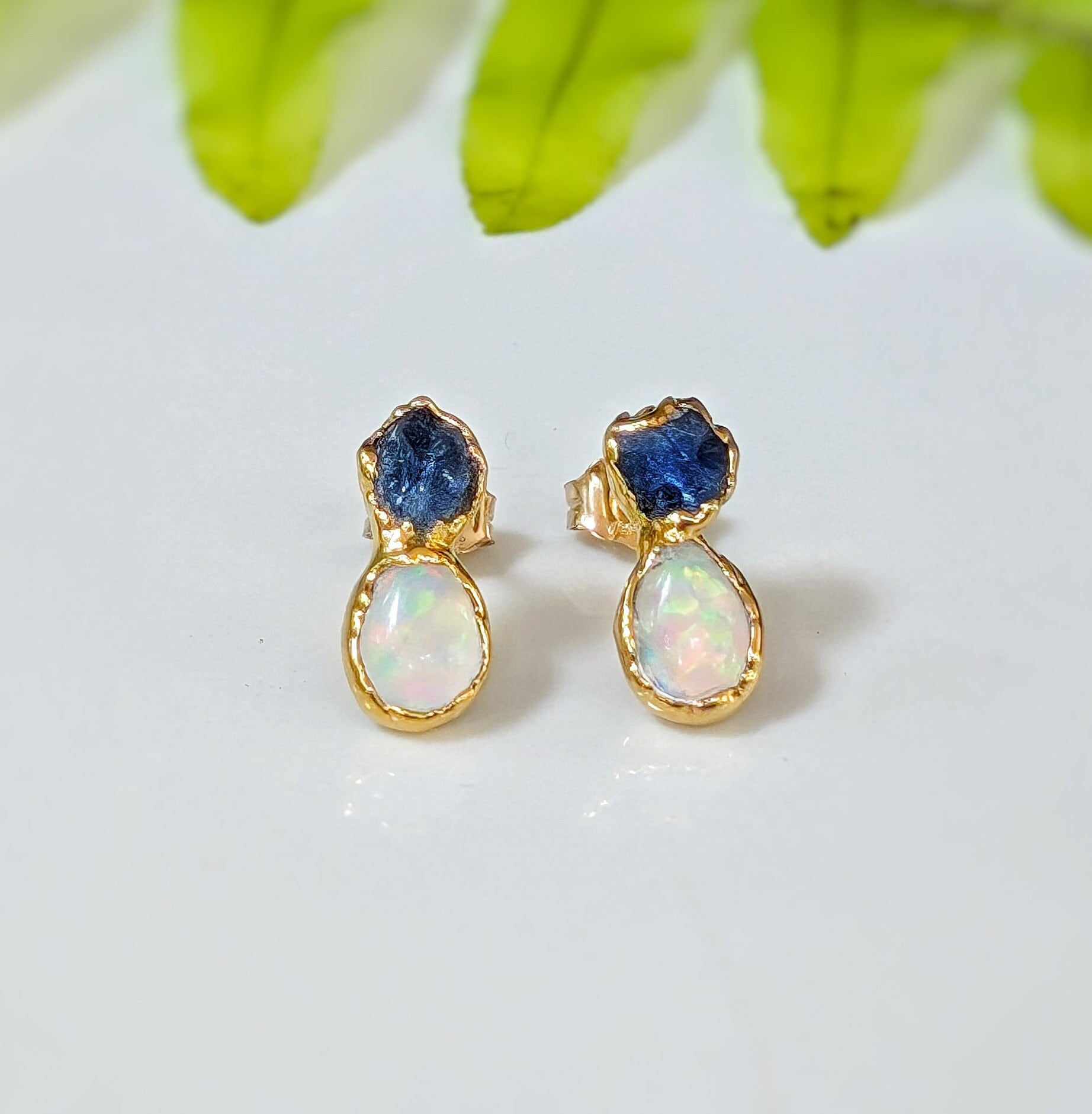 Dainty raw Sapphire and Opal stud earrings with gold setting, perfect for bridal or everyday elegance.
