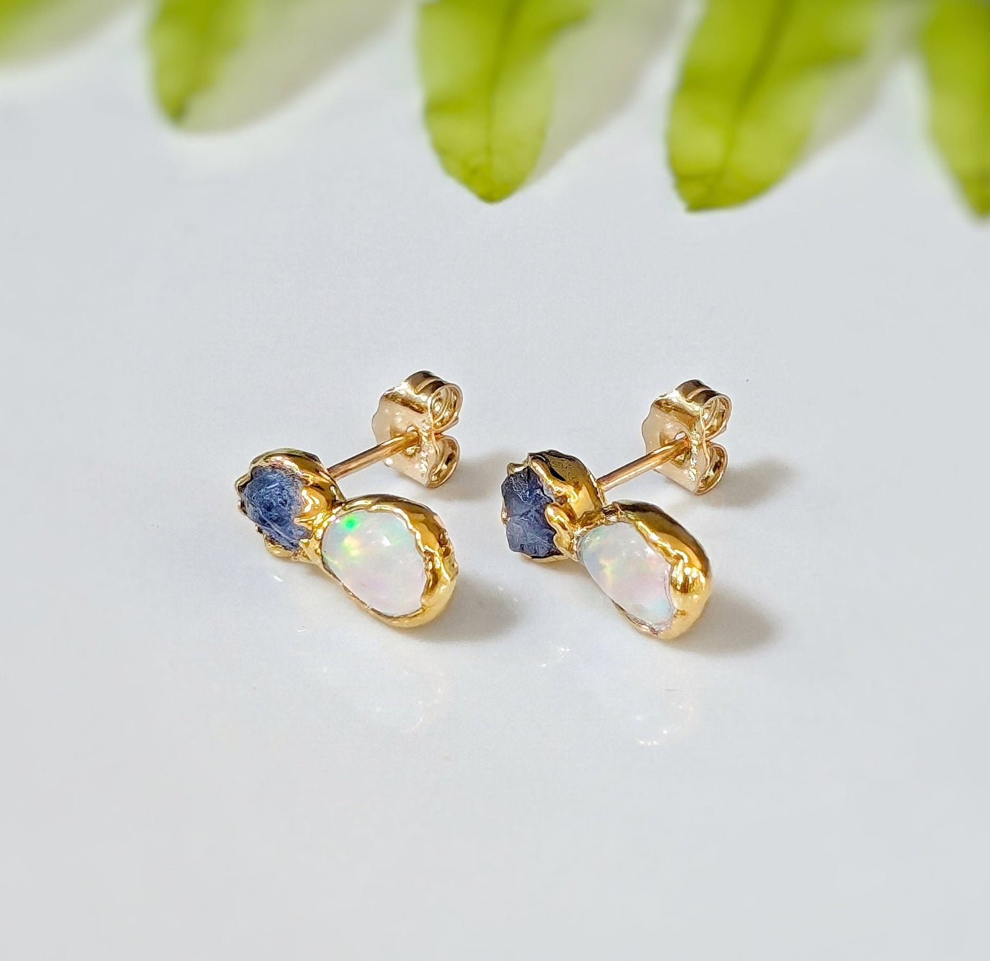 Dainty raw Sapphire and Opal stud earrings with golden accents, perfect for everyday wear or special occasions.
