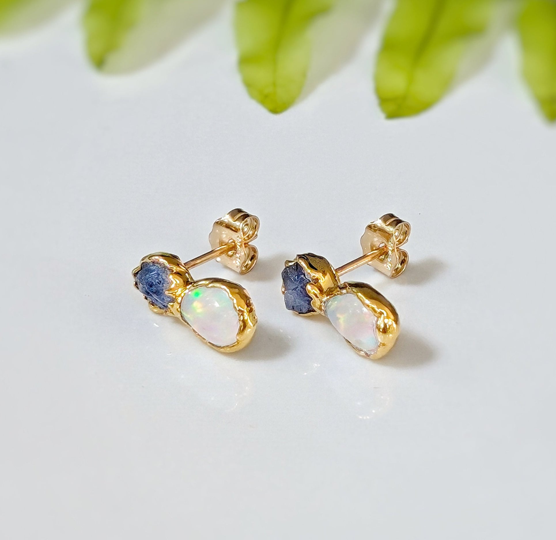 Dainty raw Sapphire and Opal stud earrings with golden accents, perfect for everyday wear or special occasions.