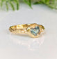 Unique Australian Sapphire ring in solid 14k gold, featuring a heart-shaped teal sapphire on a textured band.