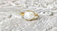 A Solid 14k Gold ring featuring a large Freshwater Pearl