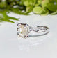 Moissanite engagement ring with cushion cut gemstone in unique textured silver setting