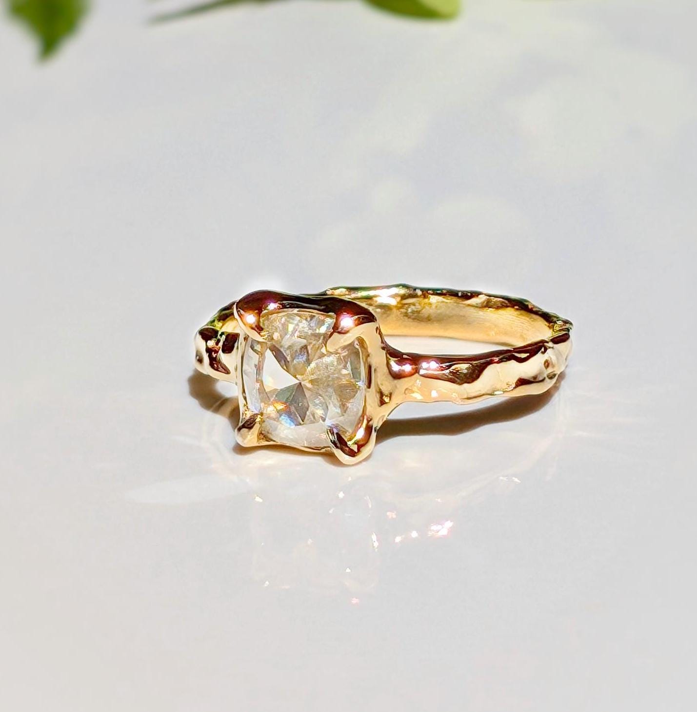 Gold Moissanite textured ring featuring an 8mm cushion cut gemstone, perfect for engagement or promise rings.