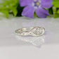 Moissanite Engagement Ring - Sterling Silver Textured Band featuring a brilliant marquise Moissanite stone set on a textured band.