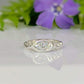 Moissanite Engagement Ring - Sterling Silver Textured Band featuring a marquise Moissanite stone on a textured band.