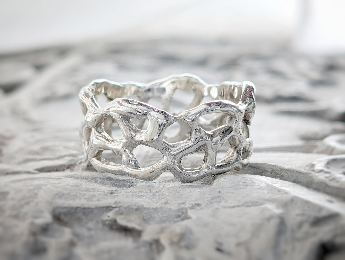 Molten Gold Honeycomb ring crafted in solid 14k gold, showcasing an abstract, nature-inspired design.