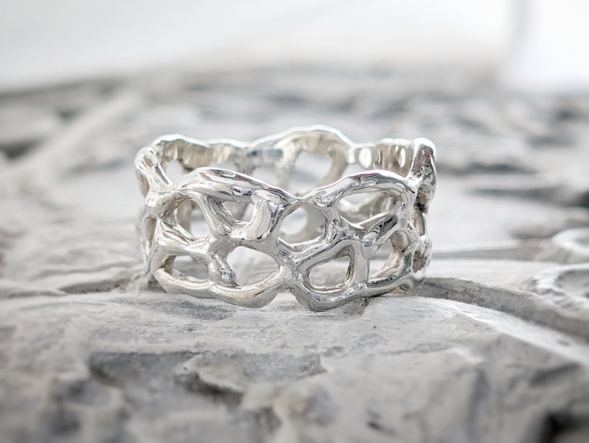 Molten Gold Honeycomb ring crafted in solid 14k gold, showcasing an abstract, nature-inspired design.