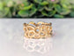 Molten Gold Honeycomb ring in solid 14k gold, showcasing an abstract honeycomb design with a reflective surface.