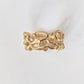 Close-up of the Molten Gold Honeycomb ring showcasing its unique hand-carved design in solid 14k gold.