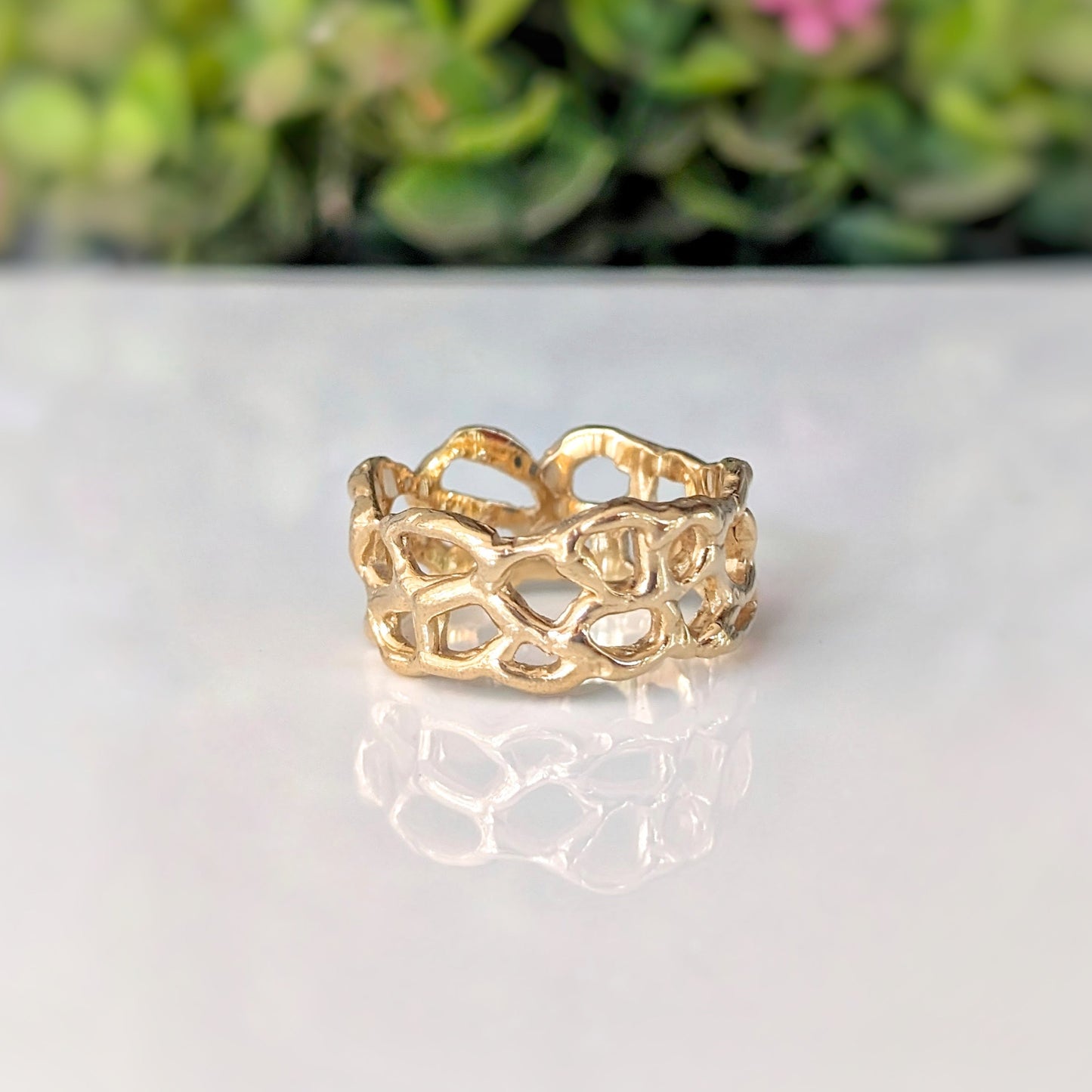Molten Silver Honeycomb ring showcasing an abstract design, highlighting its unique handcrafted details and nature-inspired elegance.