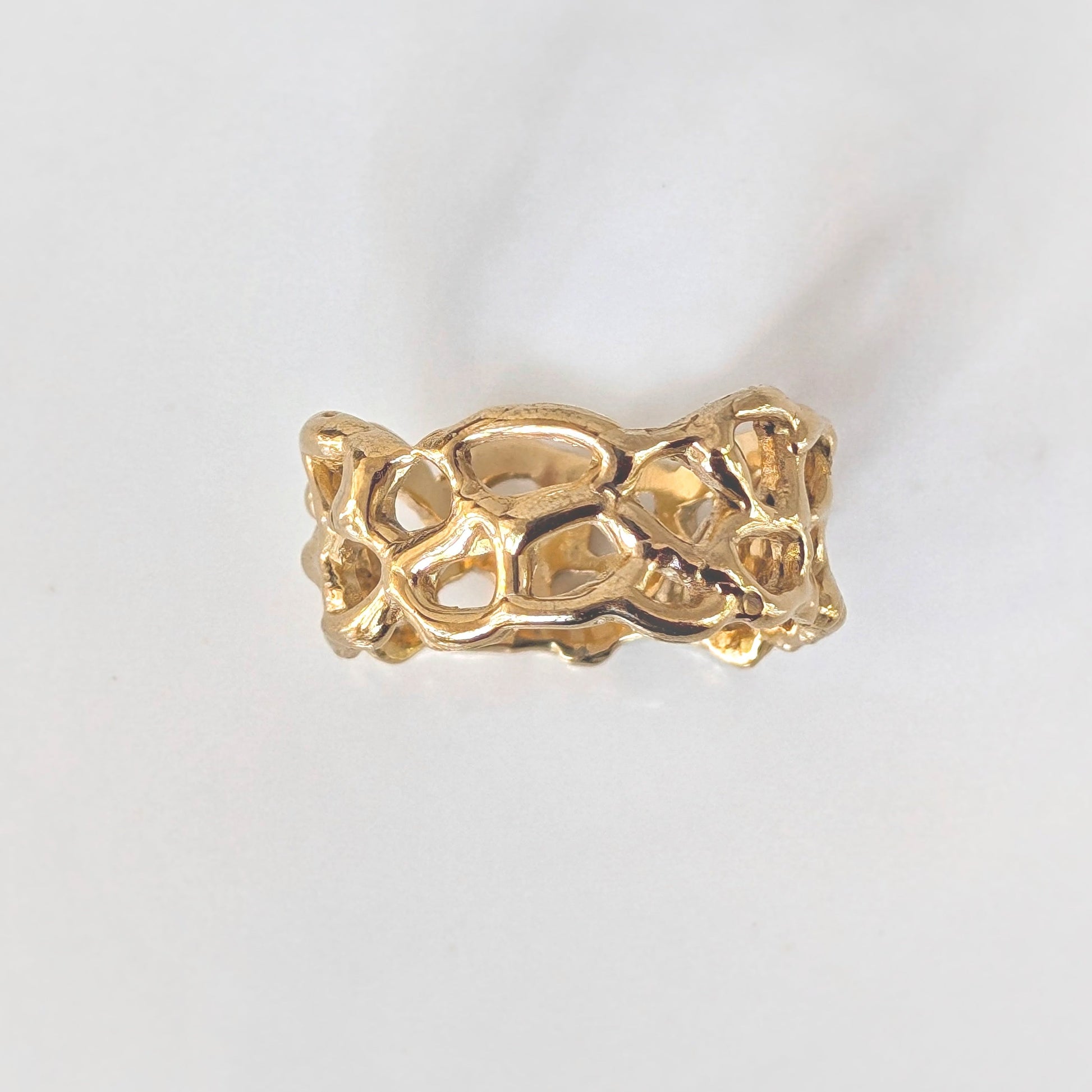 Molten Silver Honeycomb ring with abstract design, showcasing unique hand-carved details in solid sterling silver.