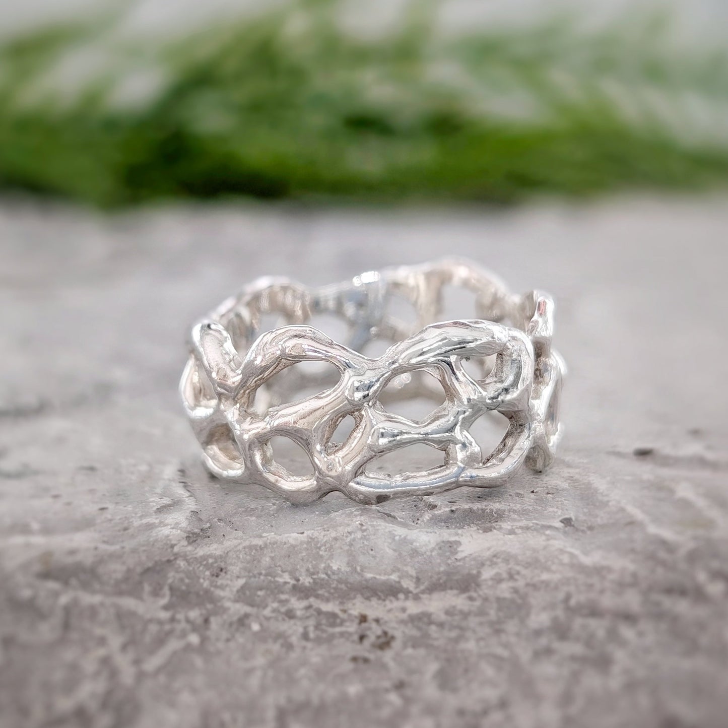 Molten Silver Honeycomb ring showcasing an abstract, hand-carved design in solid sterling silver, embodying nature's beauty.