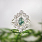 Moss Agate and raw diamond bridal ring set on silver band, showcasing unique nature-inspired design.