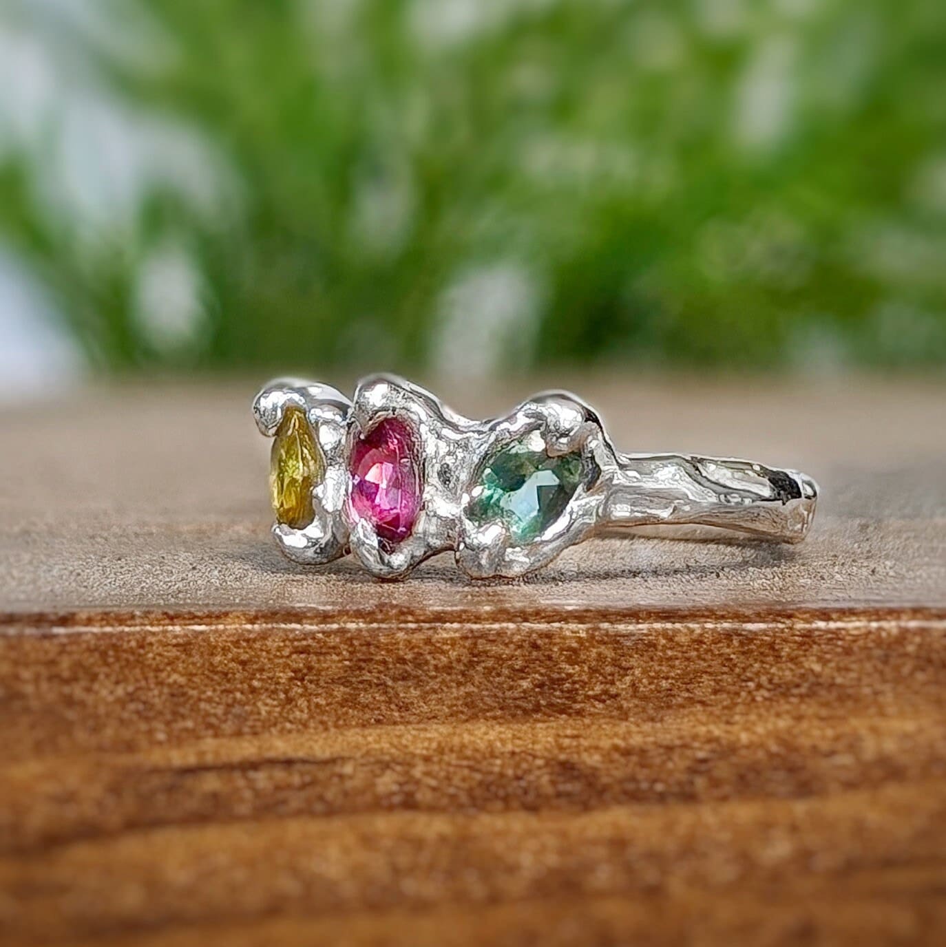 Natural multi tourmaline silver ring featuring three colorful gemstones in an organic sterling silver setting.