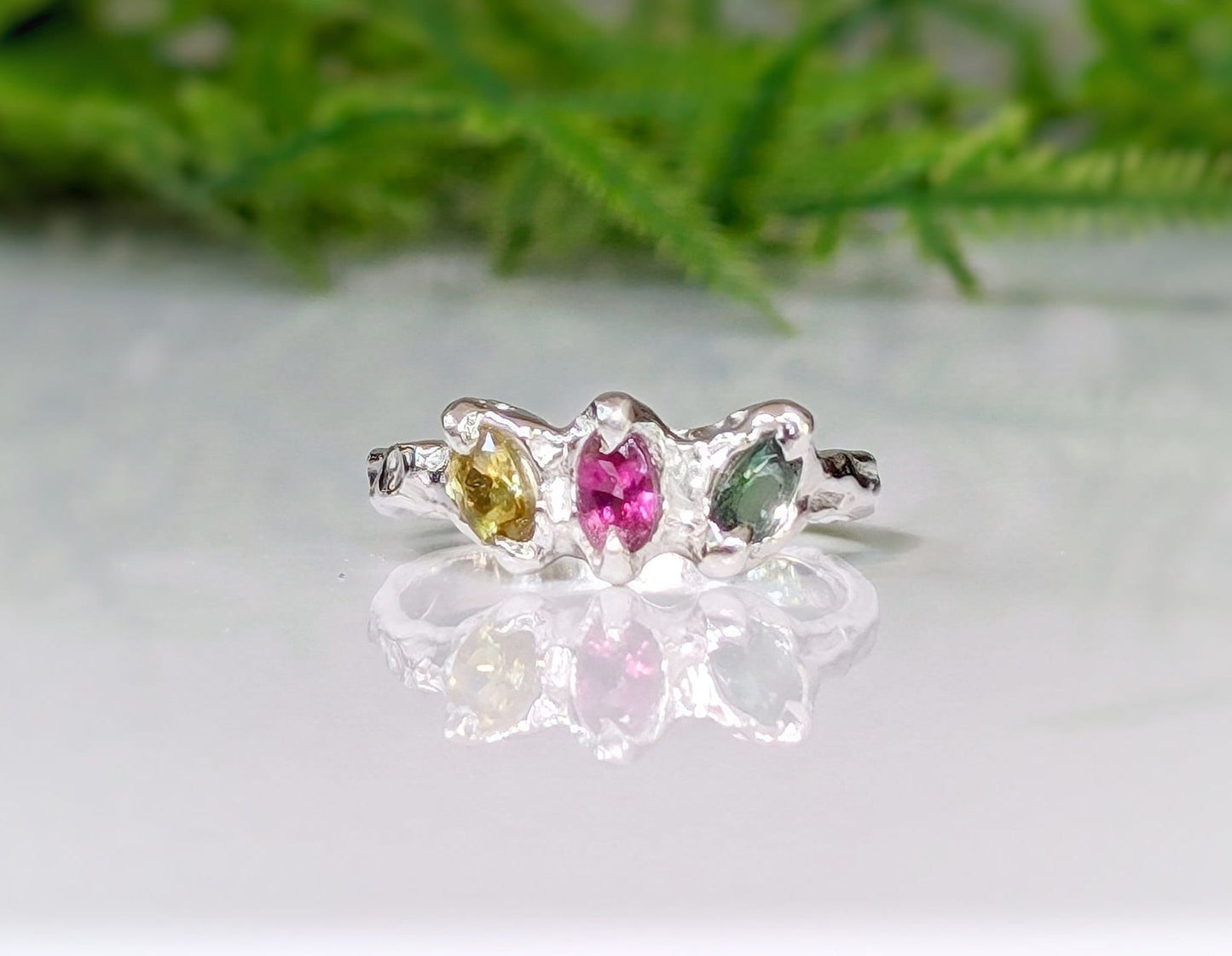 Natural multi Tourmaline sterling silver ring featuring three colorful gems in an organic design, reflecting timeless beauty.