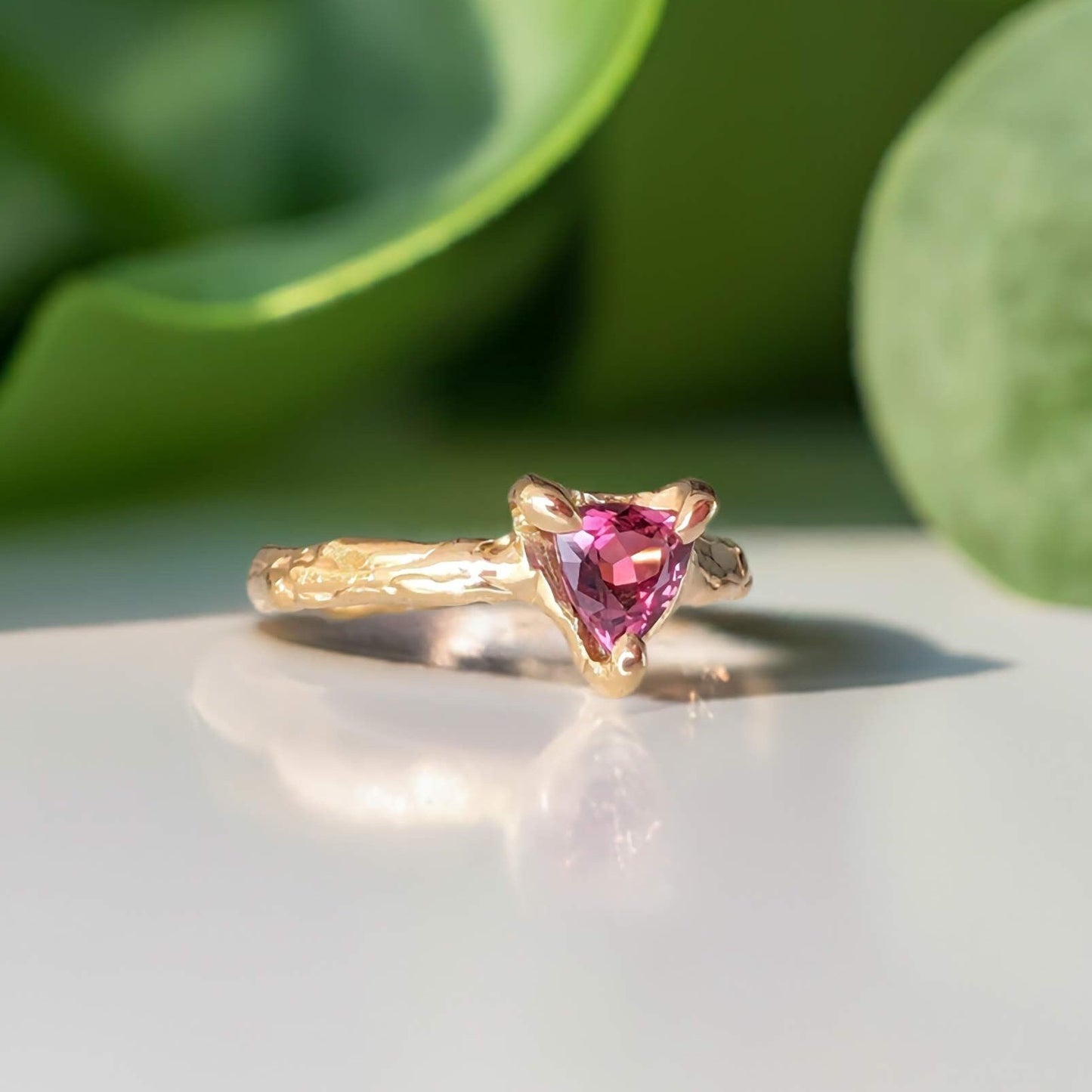 Handcrafted natural Rubellite Tourmaline ring in Sterling Silver with an organic textured band, featuring a dark pink gemstone.