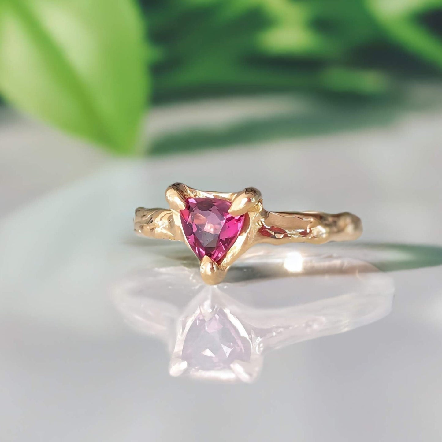 Handcrafted Rubellite Tourmaline ring in sterling silver with an organic textured band, showcasing a dark pink gemstone.