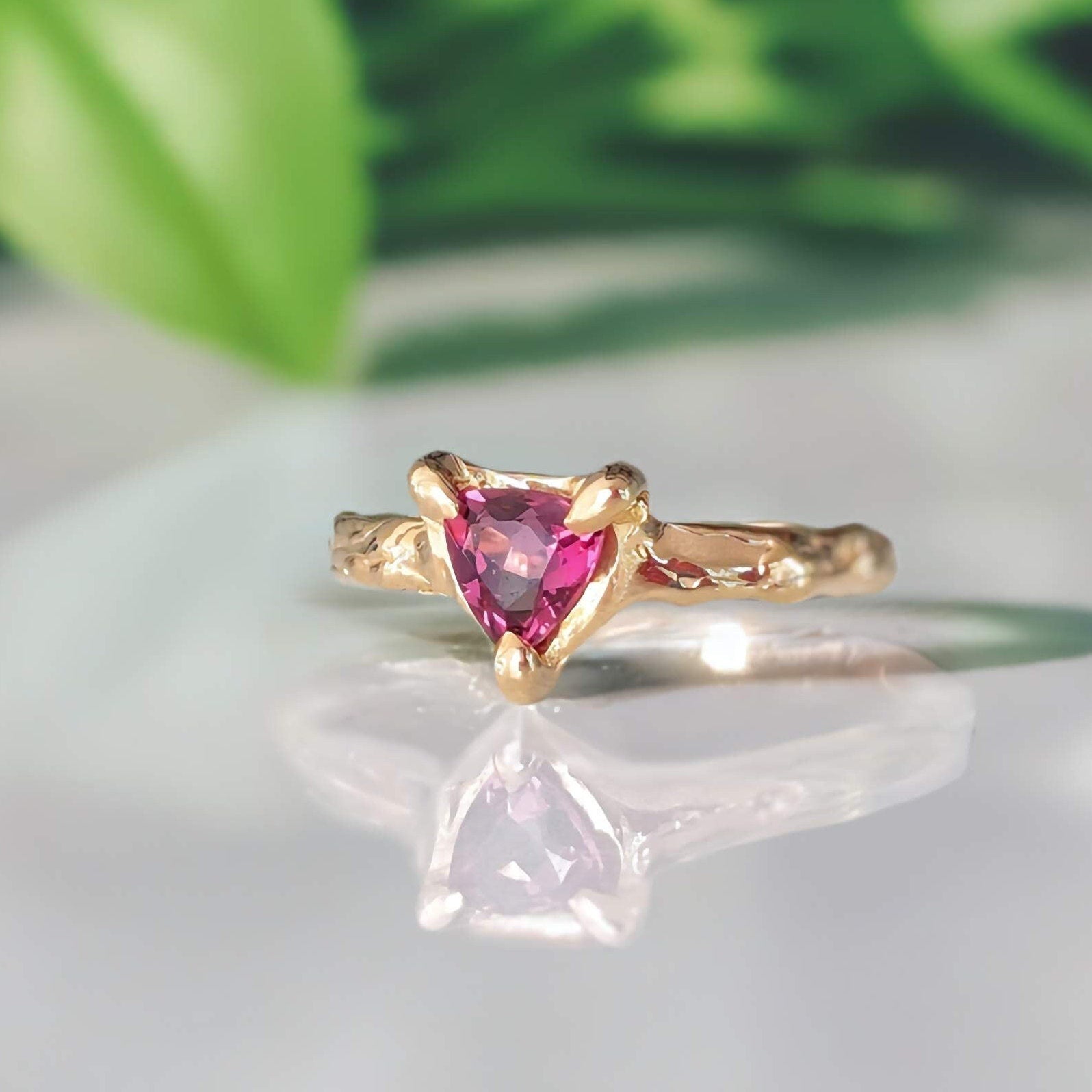 Handcrafted Rubellite Tourmaline ring in sterling silver with an organic textured band, showcasing a dark pink gemstone.