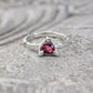 Handcrafted silver ring featuring a stunning dark pink Rubellite Tourmaline in an organic textured band.