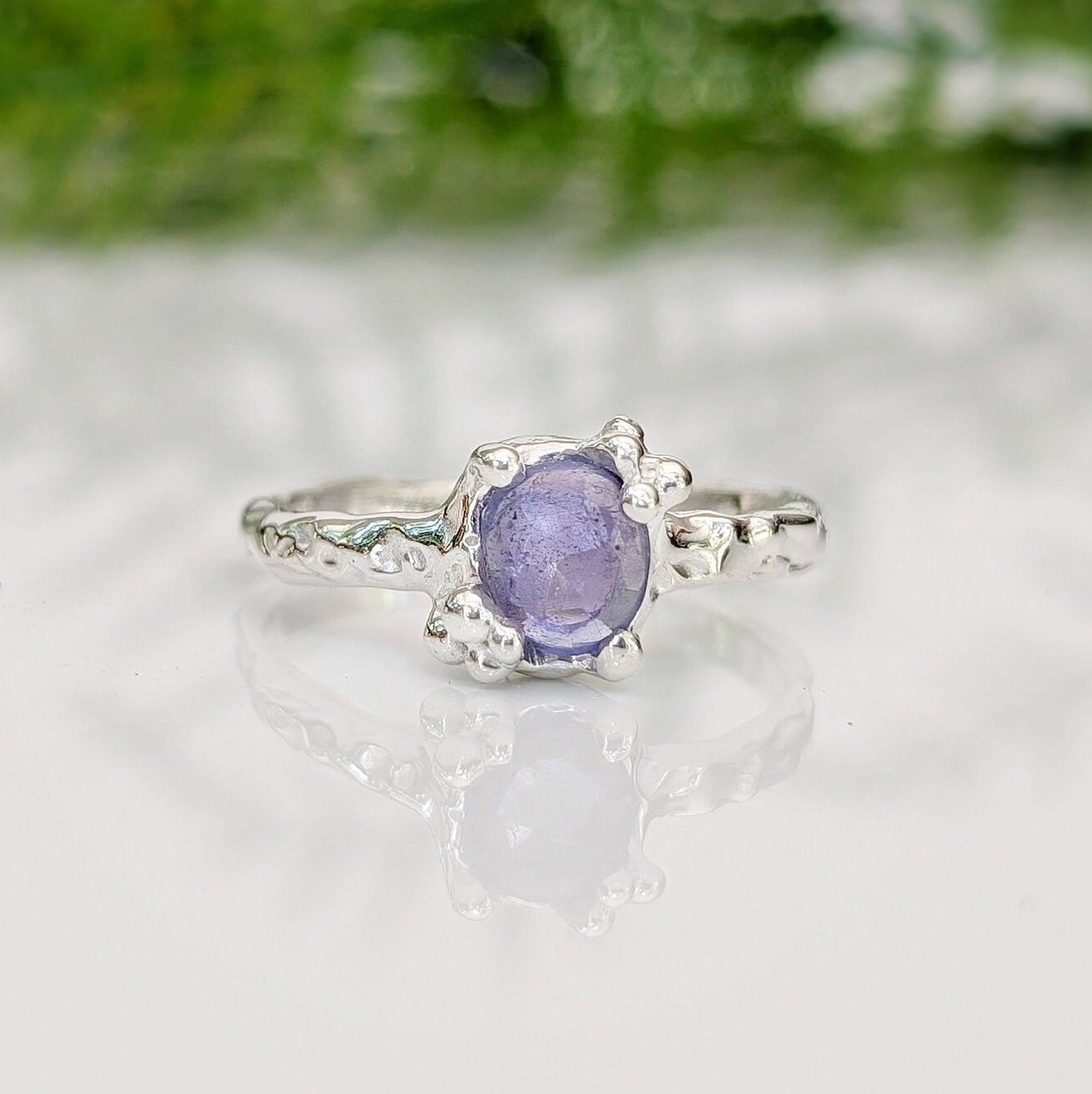 Handcrafted silver Tanzanite ring with organic texture, featuring a unique purple gemstone, ideal for meaningful gifts.
