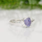 Natural Tanzanite ring in textured silver, featuring a unique organic band and a stunning purple gemstone.