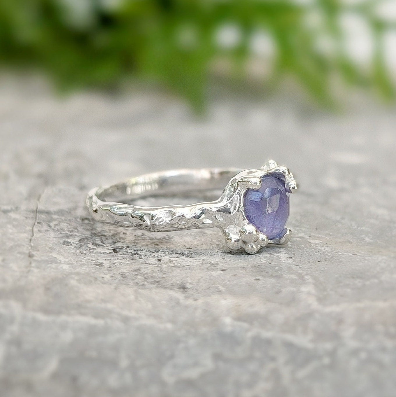 Natural Tanzanite ring showcasing a unique silver textured band, perfect for engagement or December birthdays.
