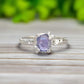 Handcrafted silver Tanzanite ring with an organic molten band, featuring a stunning purple gemstone.