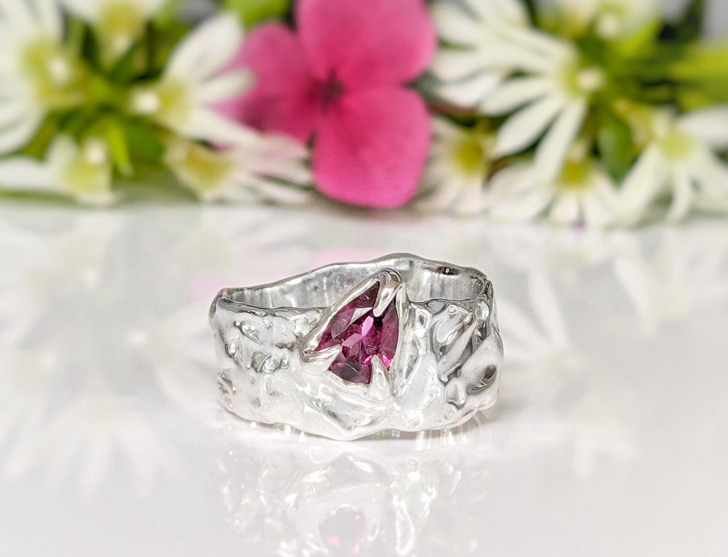 Handcrafted organic Rubellite Tourmaline ring in solid gold with unique textured setting, elegant and nature-inspired.
