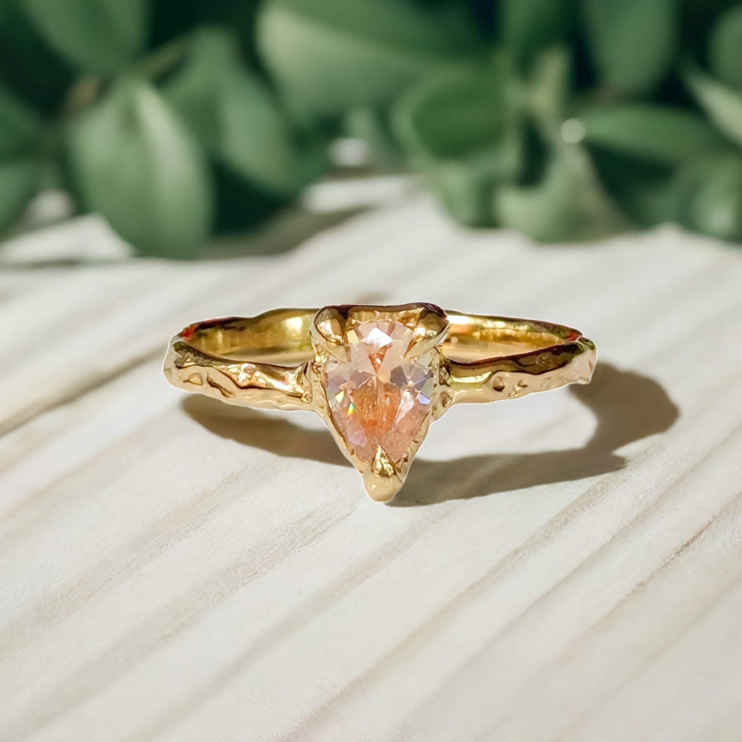Handcrafted Peach Morganite pear-shaped ring in Solid 14k Gold with an organic textured band.
