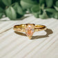 Handcrafted Peach Morganite pear-shaped ring in Solid 14k Gold with an organic textured band.