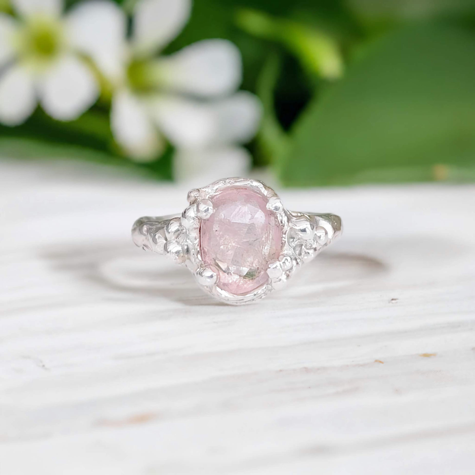 Pink Morganite engagement ring set in sterling silver with nature-inspired design, perfect for a unique proposal.