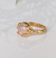 Handcrafted Pink Morganite ring in Solid 14k Gold with a textured band and oval rose cut gem.