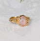 Handcrafted pink Morganite ring in solid 14k gold, featuring oval rose cut gemstone and textured band.