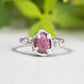 Handcrafted pink sapphire engagement ring in sterling silver with nature-inspired textured design.