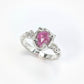 Hand-carved pink sapphire engagement ring in sterling silver featuring a pear shape rose cut stone.